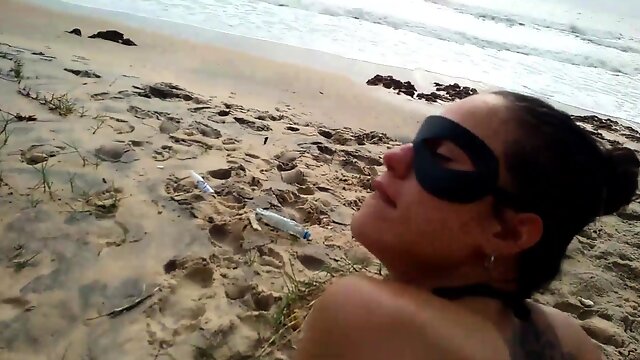 Masked milf slut pumped full of cock doggystyle on the beach