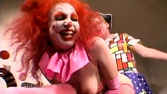 Freaky babes in clown suits have a lesbian group sex party