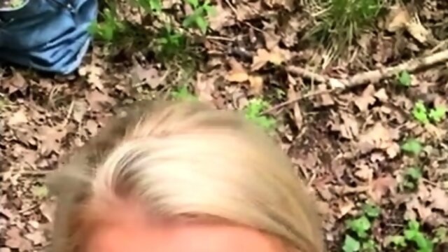 Striking blonde milf sucks off a big cock outdoors in POV