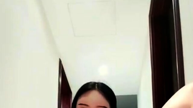 Dazzling Asian girl has fun with a meat pole and a sex toy