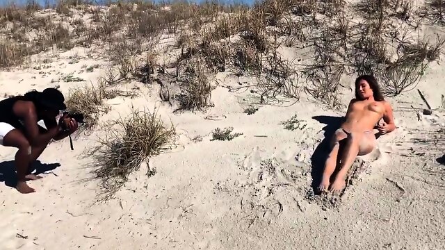 Sexy slender brunette flaunts her amazing body on the beach