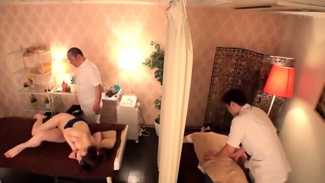 Busty Asian milf has a masseur fingering her peach to climax
