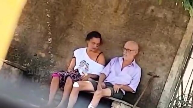 Wild brunette takes an old mans cock for a ride in public