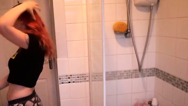 Cute redhead camgirl reveals her lovely body in the shower