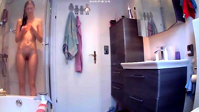 Amateur teen with a lovely ass takes a shower on hidden cam