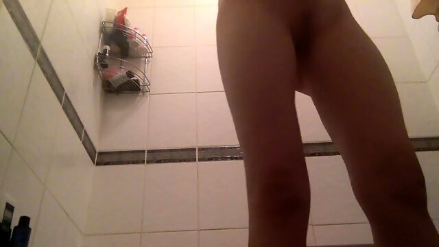 Cute teen with a fabulous ass takes a shower on hidden cam