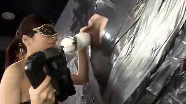 Helpless guy has a kinky Asian dominatrix pleasing his cock