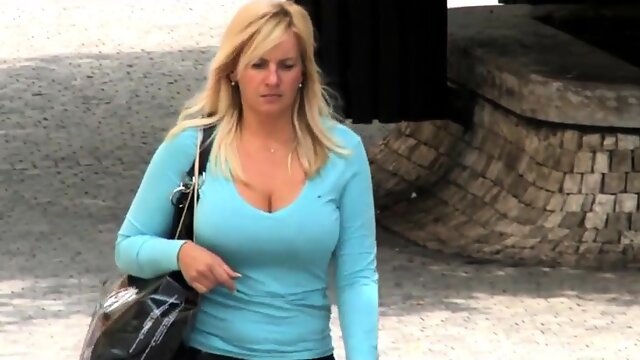 Street voyeur finds a big breasted blonde cougar outside
