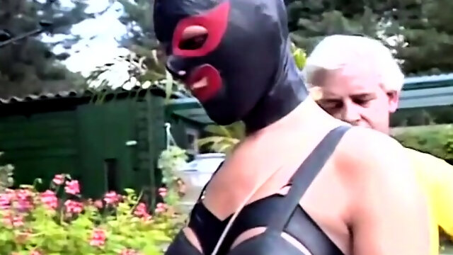 Masked slavegirl in the skillful hands of old bondage master