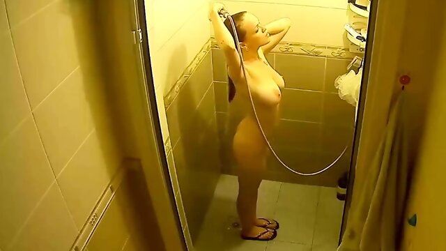Spying my busty showering step sister