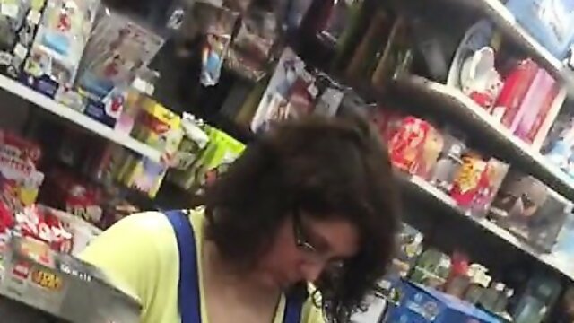 Chubby brunette cashier with enormous boobs caught on a spy