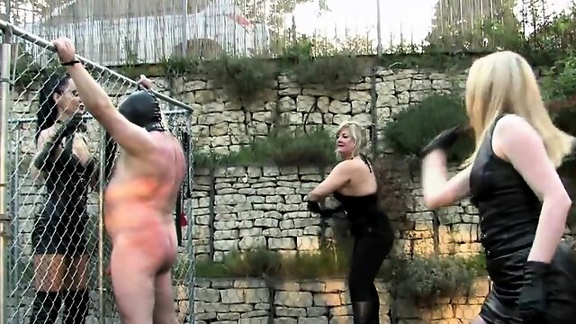 Femdom harshly punish sub with whips outdoor