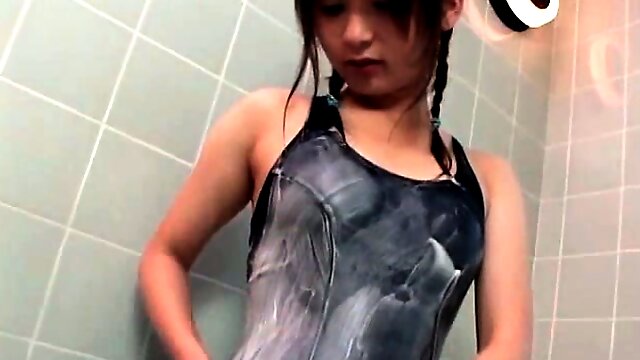 Sexy asian teen in swimsuit showers