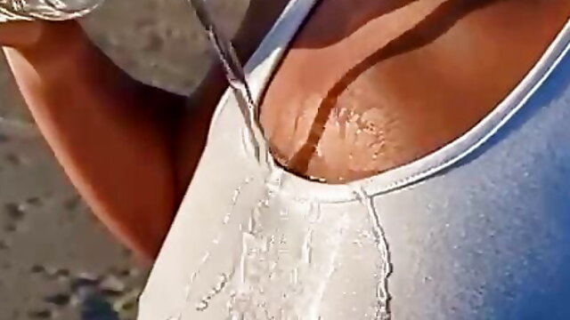 Big ass latina pouring water over her nipples