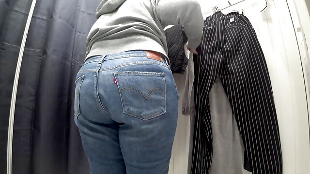 In a fitting room in a public store, the camera caught a chubby milf with a gorgeous ass in transparent panties. PAWG.