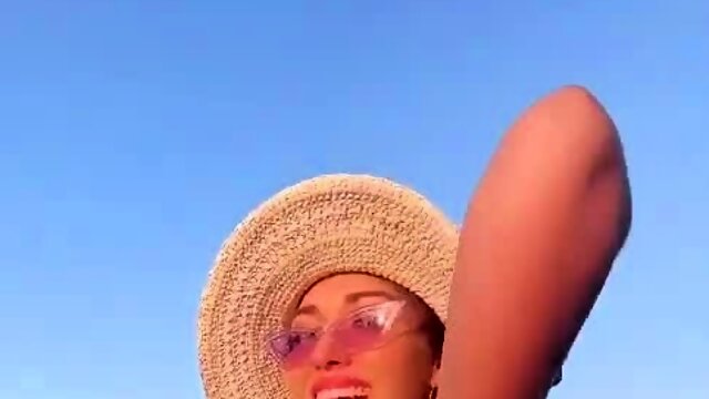 Pigtailed amateur teen poses in a sexy bikini outdoors