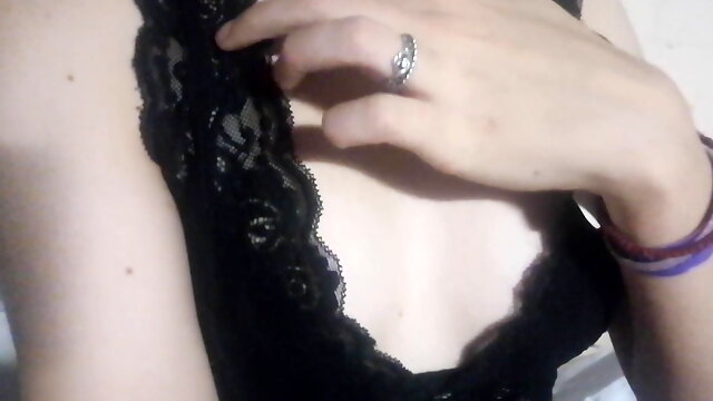 Gentle striptease in black lace lingerie. Close-up