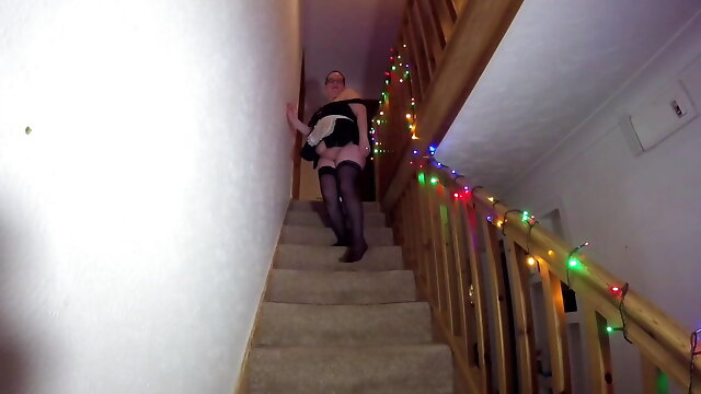 Maid cleaning the stairs in stockings 