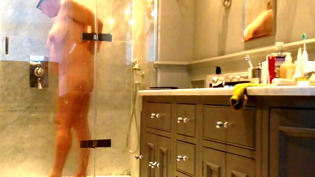 Voyeur unaware milf in the shower