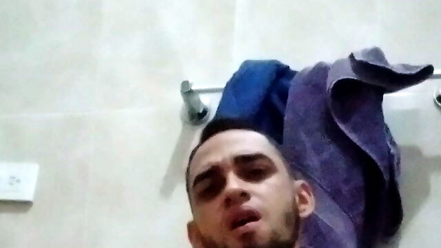 Sexy latino touches his hard cock in the bathroom at home