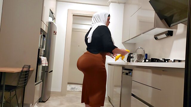 My stepmother wears a skirt for me and shows me her big butt.