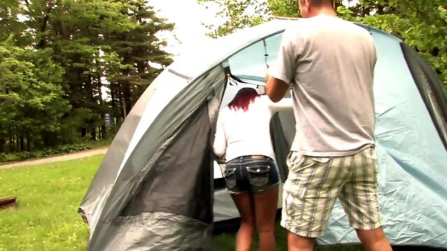 Redhead chick Kylee shows her small tits while giving a handjob