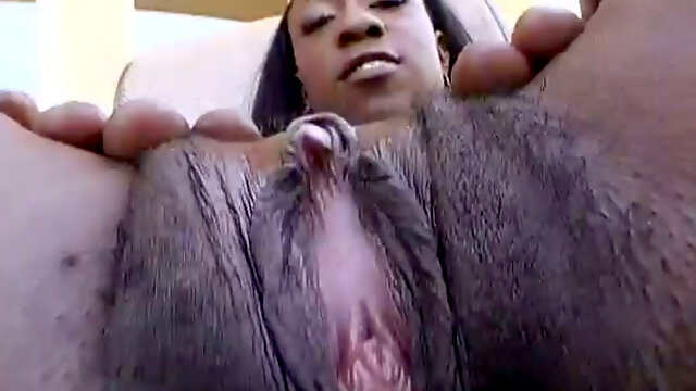 This black chick has a long tongue and she knows how to masturbate