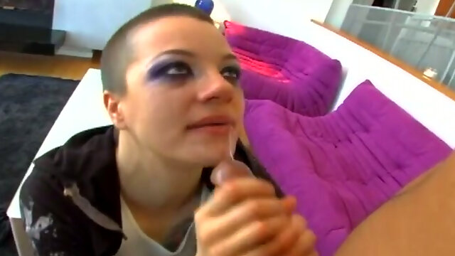 Wild short haired punk bitch with heavy makeup sucks strong big cock