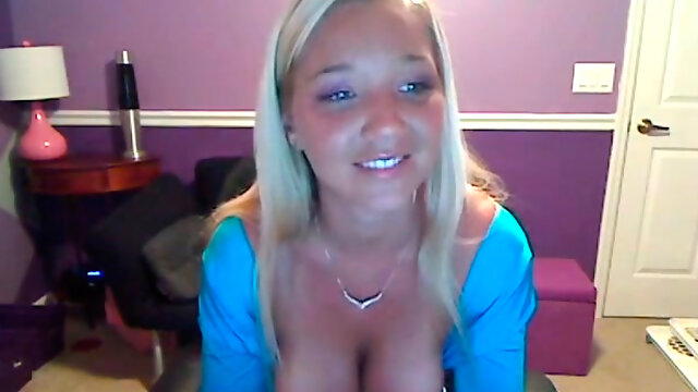 Naughty blonde with massive full natural boobs strips on a web camera