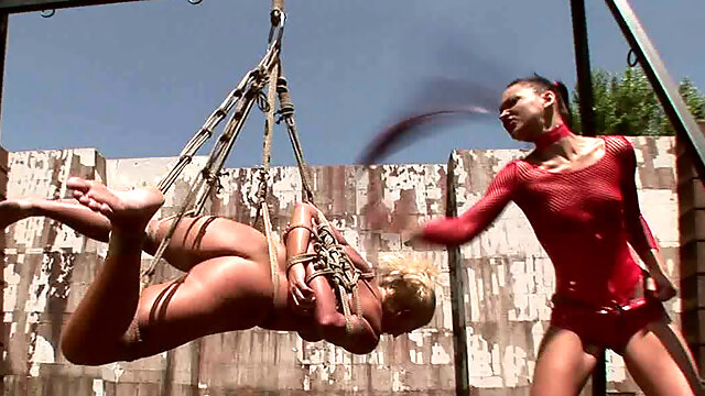 Sophisticated domina puts clothing pegs on curvy blondie in BDSM video