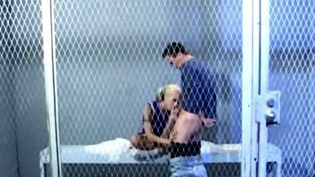 Spoiled blond prostitute Cindy Crawford gives a blowjob to co-prisoner