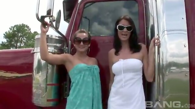 Seductive shapely ladies flash their butts and tits next to big trucks