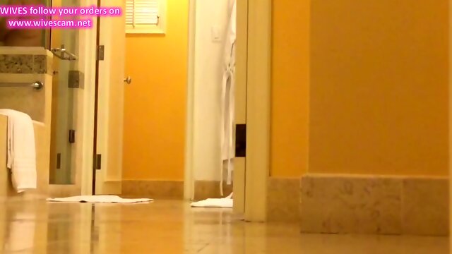 Unaware MILF caught on hotel bathroom hidden cam