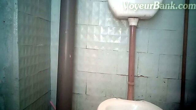 White pale skin Russian chick in the public restroom pissing in a bottle