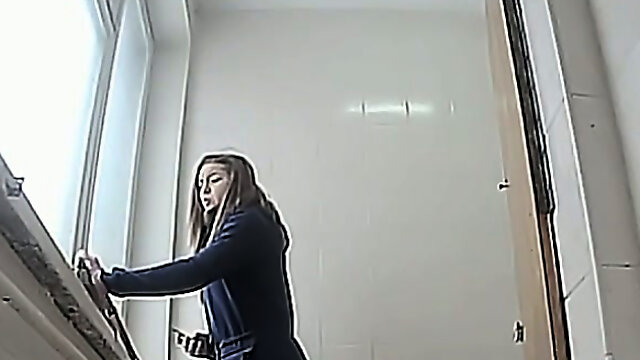 Brunette young white chick in the toilet pisses on hidden cam