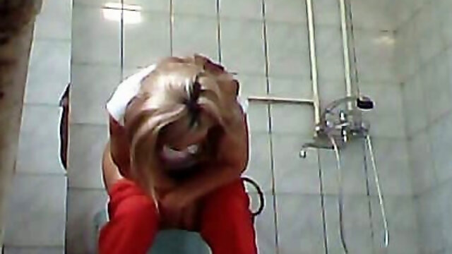 Blonde adorable lady in red panties filmed on hidden cam in the toilet