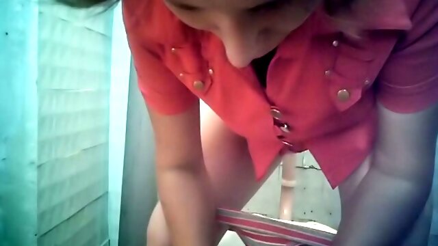 Lovely blondie in the toilet room got her pussy flashed on hidden cam