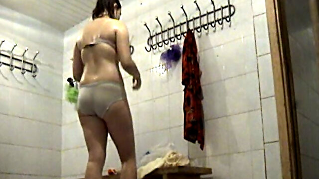 Chunky brunette white lady drying up in the locker room