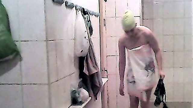 Lovely white ladies in the shower room undressing and washing together