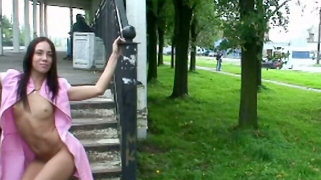 Fine and sultry lean brunette teen in pink dress shows her goodies at the train station