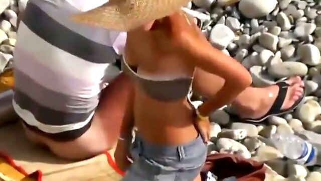 Tanned blonde wife of my buddy loves to ride him outdoors on the beach