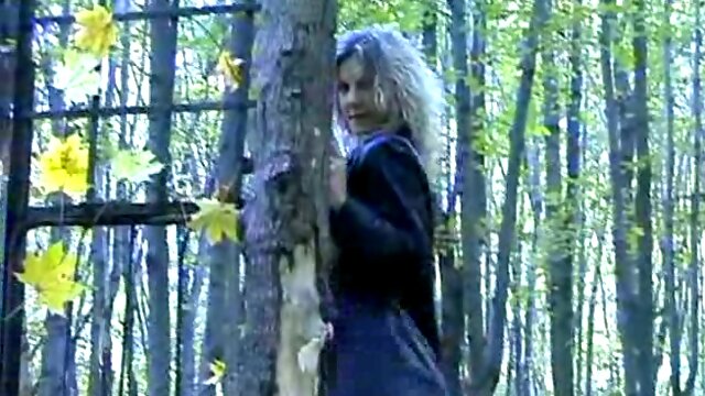 Mesmerizing curly haired blonde teen in the woods shows her goodies