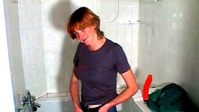Redhead Russian milf with big saggy boobies washes and masturbates in the bathroom