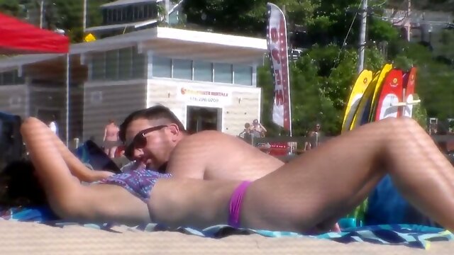 My hubby spied on slender bikini chick sitting next to us on the beach