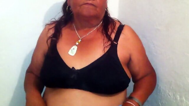 Mature grey haired slut with ugly fat belly and big rack stripteased on cam