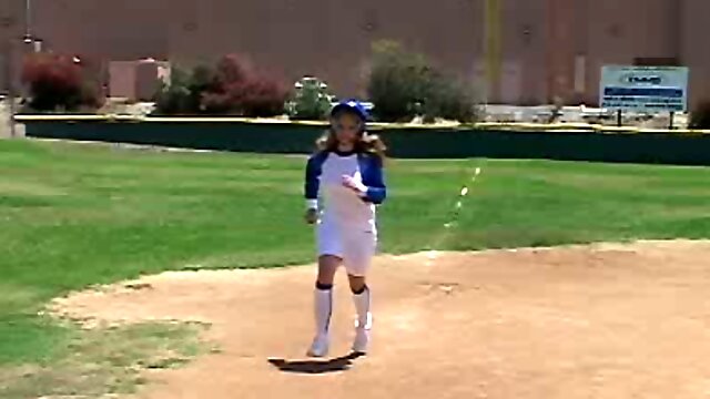 Sizzling hot and pretty blonde college girl in baseball uniform