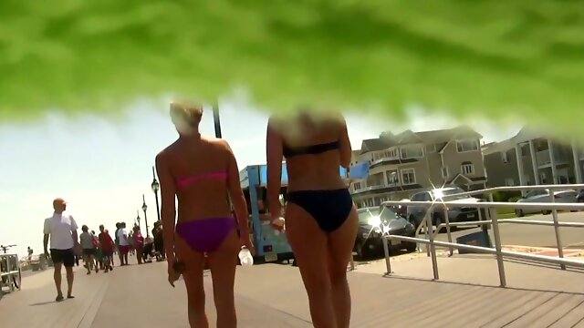 My friend made an upskirt spy cam video of bikini girls moving to the beach