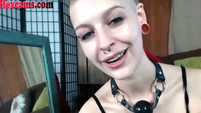 This mohawk webcam girl loves to show off her pink pussy hole