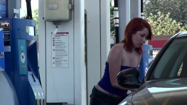 Sassy redhead golddigging bimbo pumping gas in her bimmer