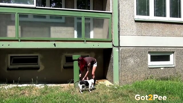 Redhead European teen hides under the balcony and urinates